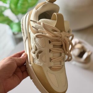 Luxury-inspired beige chunky sneakers with mesh upper and 3D floral detailing