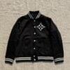 Luxury black varsity jacket for men with embroidered chest badge and striped collar