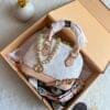 Luxury-inspired women’s handbag set with chain handle, pastel finish and gold accessories
