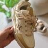 Luxury-inspired beige chunky sneakers with mesh upper and 3D floral detailing